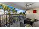 Relaxing covered balcony with ceiling fan and views of the surrounding lush landscaping at 537 Fore Dr, Bradenton, FL 34208