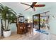 Cozy bar area with custom wood finishes and access to the patio and pool at 537 Fore Dr, Bradenton, FL 34208