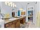 Bathroom with double sinks, granite countertops, and a view into the bedroom at 537 Fore Dr, Bradenton, FL 34208