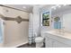 Bright bathroom features a walk-in shower and vanity with updated fixtures and decor at 537 Fore Dr, Bradenton, FL 34208