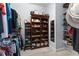 Walk-in closet with custom shelving and hanging racks for optimal storage at 537 Fore Dr, Bradenton, FL 34208