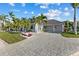 Lovely home with a large driveway, three-car garage, and a beautifully landscaped yard at 537 Fore Dr, Bradenton, FL 34208