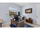 Home office featuring desk, nautical-themed area rug, and window for natural light and exterior views at 537 Fore Dr, Bradenton, FL 34208