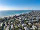 Stunning aerial view of a charming beach neighborhood with cozy houses near the ocean at 5807 De Palmas Ave, Holmes Beach, FL 34217