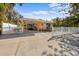 Charming single-story home with a spacious driveway and lovely white picket fence for curb appeal at 5807 De Palmas Ave, Holmes Beach, FL 34217