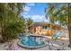 Backyard pool and home exterior with patio and landscape at 5807 De Palmas Ave, Holmes Beach, FL 34217