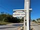 Key Royale street sign marking Baronet Lane, set against a sunny sky at 607 Baronet Ln, Holmes Beach, FL 34217