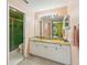 Bathroom featuring marble countertops, a shower, and soft-colored walls at 6330 Green Oak Cir # D, Bradenton, FL 34203