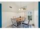 Cozy dining area with modern table set, natural light, and tile flooring at 6330 Green Oak Cir # D, Bradenton, FL 34203