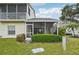 Exterior view of the home featuring a screened-in porch at 6330 Green Oak Cir # D, Bradenton, FL 34203