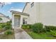 Townhome front entrance featuring a walkway to the front door and manicured landscaping at 6330 Green Oak Cir # D, Bradenton, FL 34203