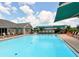 Community pool with plenty of lounge seating by the water at 6330 Green Oak Cir # D, Bradenton, FL 34203