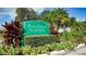 A beautiful sign for Plantation Gardens at Tara with colorful flowers and lush greenery at 6330 Green Oak Cir # D, Bradenton, FL 34203