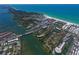 Breathtaking aerial view of the community, showcasing the beach and waterfront access at 6415 Midnight Pass Rd # 508, Sarasota, FL 34242