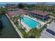 Aerial view featuring a pool and tennis courts at 6415 Midnight Pass Rd # 508, Sarasota, FL 34242