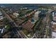 Aerial view of a waterfront community featuring tennis courts, a swimming pool, and convenient road access at 6415 Midnight Pass Rd # 508, Sarasota, FL 34242