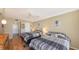 Comfortable bedroom featuring two beds, ceiling fan, and ensuite bathroom at 6415 Midnight Pass Rd # 508, Sarasota, FL 34242