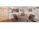 Dining room features a wooden table with tiled flooring and a partial view of the kitchen at 6415 Midnight Pass Rd # 508, Sarasota, FL 34242