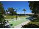 Outdoor shuffleboard with cornhole and bridge view in a meticulously maintained common area at 6415 Midnight Pass Rd # 508, Sarasota, FL 34242