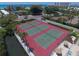 Aerial view showcasing well-maintained tennis courts at 6415 Midnight Pass Rd # 508, Sarasota, FL 34242