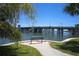 Waterfront view featuring a bench and a pathway to the bridge at 6415 Midnight Pass Rd # 508, Sarasota, FL 34242