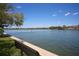 Scenic waterfront view with boat activity and seating at 6415 Midnight Pass Rd # 508, Sarasota, FL 34242