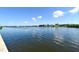 Expansive waterfront view, showcasing the tranquil water and scenic shoreline at 6415 Midnight Pass Rd # 508, Sarasota, FL 34242