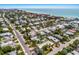 Coastal community aerial shot with bright homes, lush trees, and ocean views at 6606 Holmes Blvd # 3, Holmes Beach, FL 34217