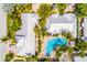 Stunning aerial view of a home and private pool, showcasing lush landscaping at 6606 Holmes Blvd # 3, Holmes Beach, FL 34217