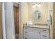 Well-lit bathroom featuring granite vanity top, neutral color palette, and a glass enclosed walk-in shower at 6606 Holmes Blvd # 3, Holmes Beach, FL 34217