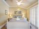 Bright bedroom featuring a large bed with neutral bedding, complemented by two bedside tables at 6606 Holmes Blvd # 3, Holmes Beach, FL 34217