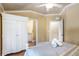 Cozy bedroom features a full wardrobe and an ensuite bathroom at 6606 Holmes Blvd # 3, Holmes Beach, FL 34217