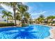 Inviting pool with waterfall feature and beautiful surrounding landscaping, perfect for relaxation at 6606 Holmes Blvd # 3, Holmes Beach, FL 34217