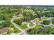 Aerial view of a home in a lush neighborhood near a golf course at 6624 Fairway Dr, Sarasota, FL 34243