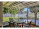 Backyard patio featuring a patio table with seating and string lights at 6624 Fairway Dr, Sarasota, FL 34243