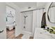 Bright bathroom featuring a shower with black fixtures and a modern sink at 6624 Fairway Dr, Sarasota, FL 34243