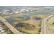 Extensive wetlands offering a habitat-rich landscape, bordered by roads and industrial development in the far distance at 6637 Deering Cir, Sarasota, FL 34240