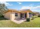 Charming backyard with a tiled-roof home and a screened in patio at 6637 Deering Cir, Sarasota, FL 34240