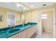 Bathroom with double sinks, a large mirror, and ample counter space at 6637 Deering Cir, Sarasota, FL 34240