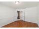 Bedroom with hardwood floors and an open doorway into an adjoining space at 6637 Deering Cir, Sarasota, FL 34240