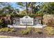 Community sign with lush surrounding landscape at 6637 Deering Cir, Sarasota, FL 34240