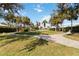 Community area with mature trees, lush grass, and walking path at 6637 Deering Cir, Sarasota, FL 34240