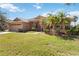 Inviting single-story home with a two-car garage, mature landscaping and a well manicured lawn at 6637 Deering Cir, Sarasota, FL 34240