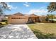 Charming single-story home featuring a tile roof, two-car garage, and well-maintained landscaping at 6637 Deering Cir, Sarasota, FL 34240