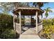 Community gazebo overlooking tranquil lake with lush landscaping at 6637 Deering Cir, Sarasota, FL 34240