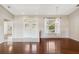 Bright living room with hardwood floors, a chandelier, and large windows offering natural light at 6637 Deering Cir, Sarasota, FL 34240