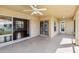 A covered outdoor patio area with tile flooring and views of the home's interior at 6637 Deering Cir, Sarasota, FL 34240