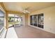 Covered patio with a ceiling fan and views of the outdoor green space at 6637 Deering Cir, Sarasota, FL 34240