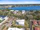 Wide aerial view of property near a body of water showing waterfront homes at 6640 Peacock Rd, Sarasota, FL 34242