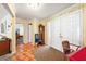 Charming foyer with terra cotta tile floors, traditional decor, and a welcoming entrance at 6640 Peacock Rd, Sarasota, FL 34242